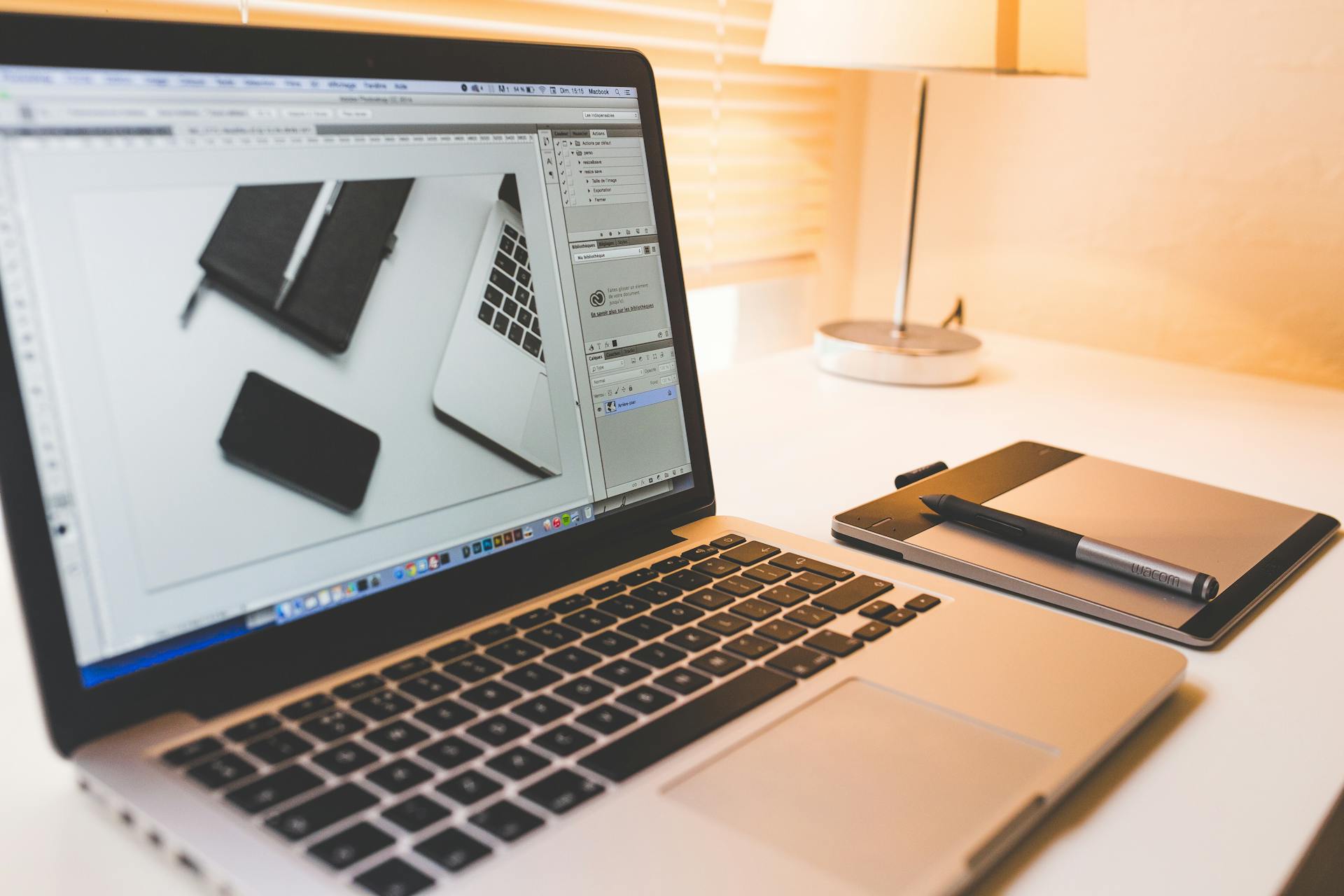 Designer working on brand identity with attention to detail at a clean workspace