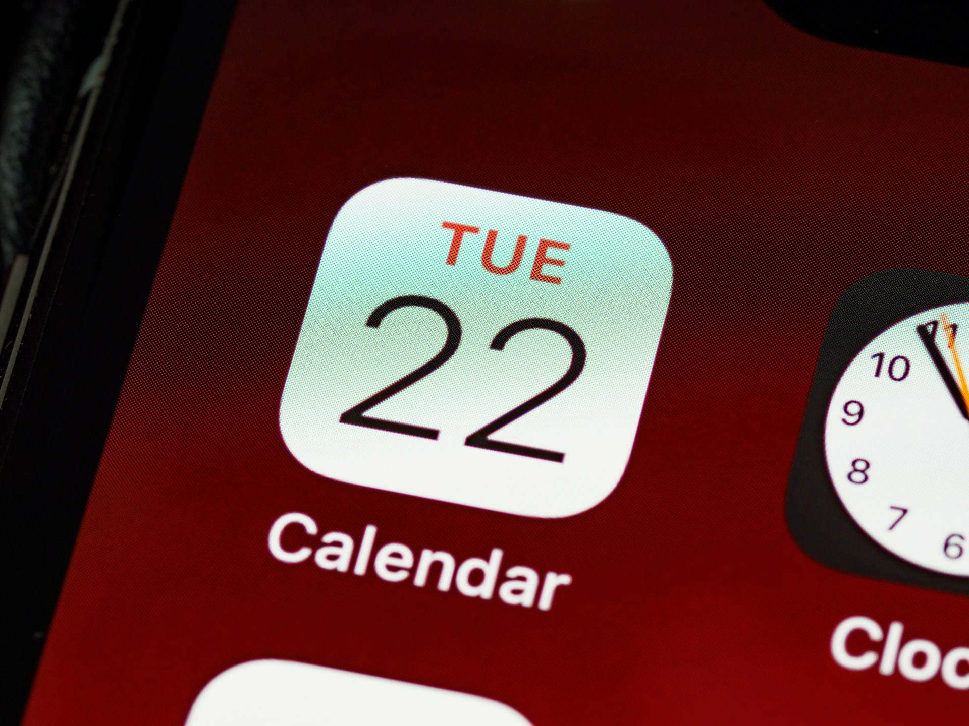 Person scheduling a meeting on their phone with a calendar app open