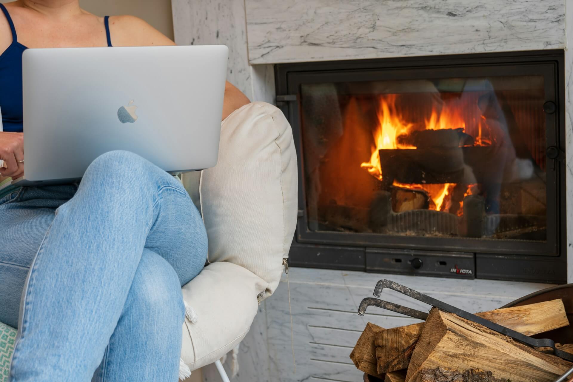 Small business owner setting up their website on a laptop in a bright home office